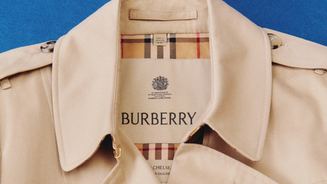 A close-up of the iconic Burberry trench coat, showcasing its signature check lining.